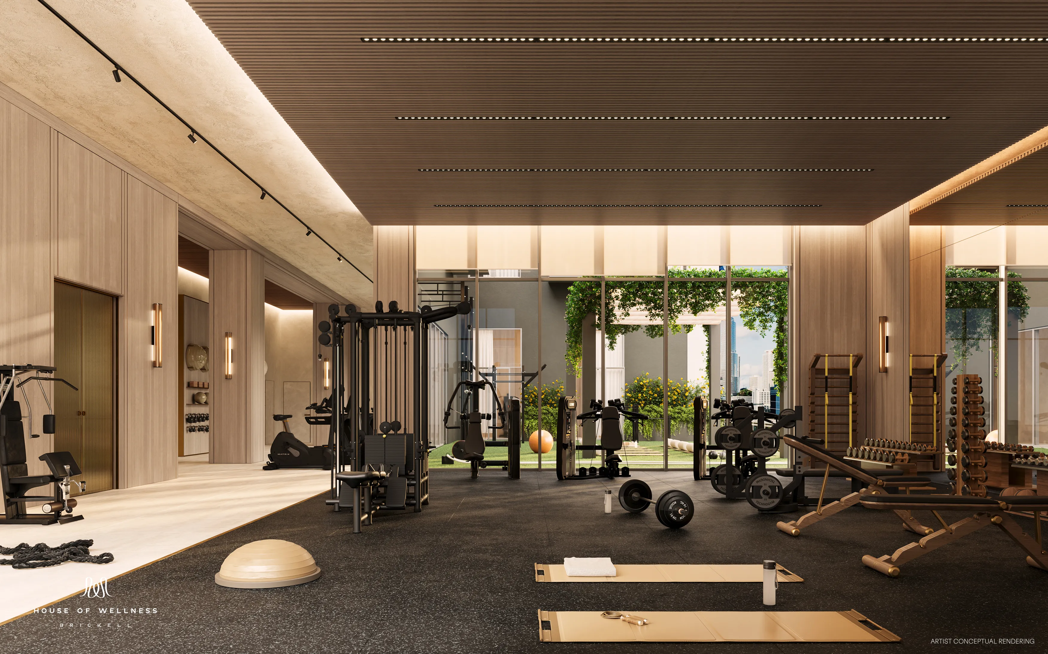 Indoor fitness center with modern equipment and city views