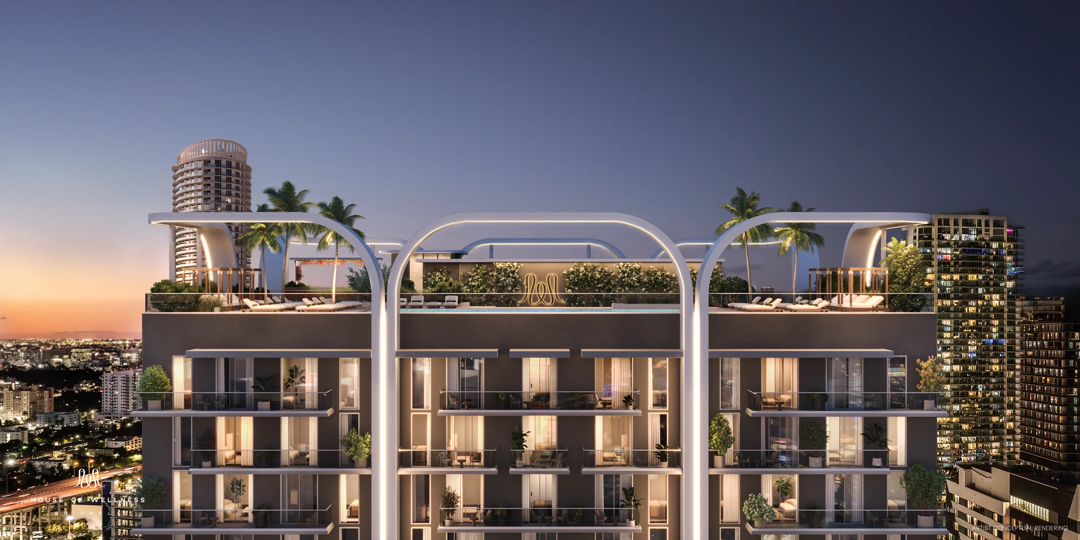 Rooftop pool area at dusk with ambient lighting